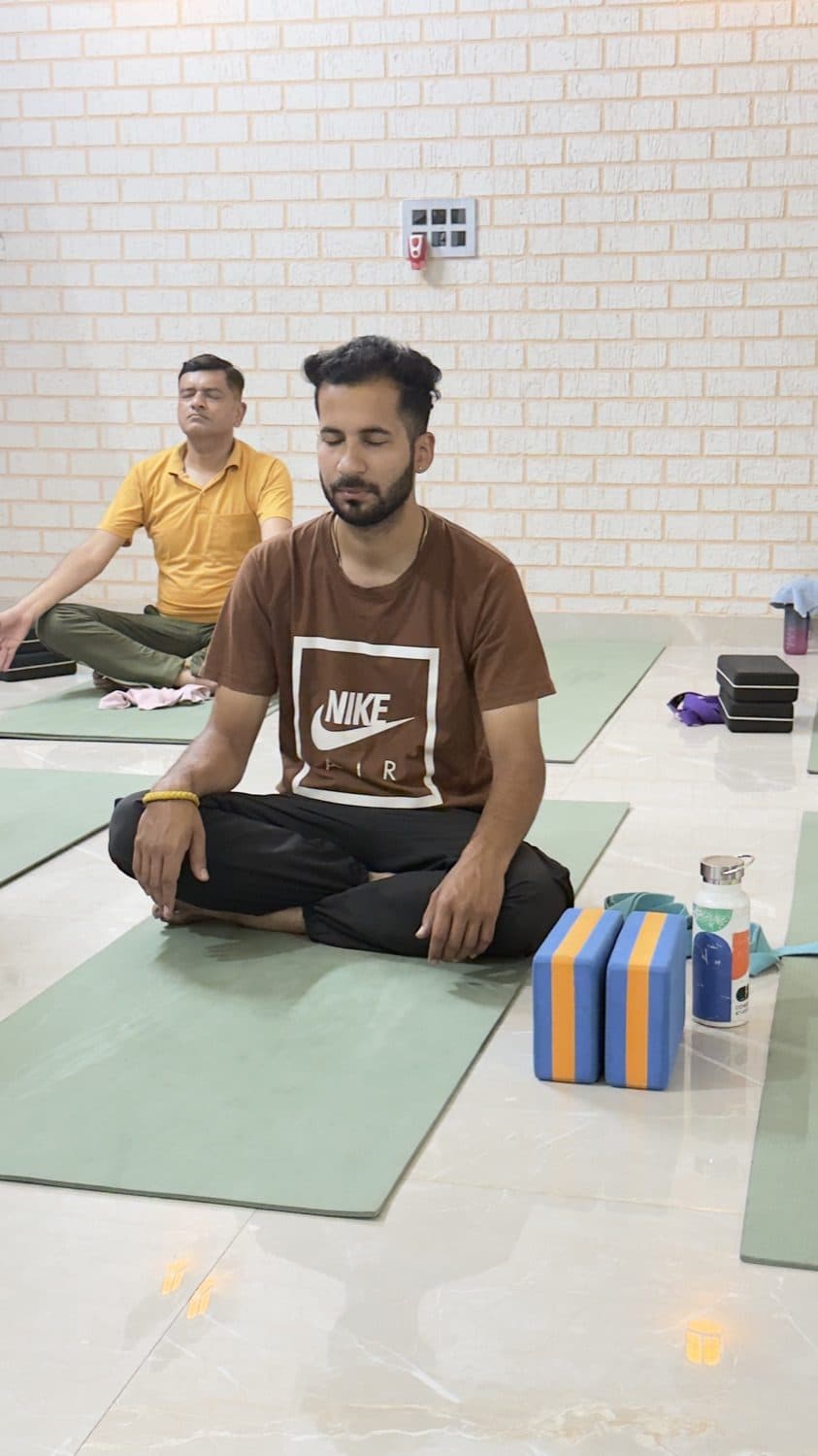 Two students in seated meditation